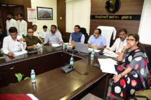 Guardian Minister Makarand Patil reviews crop insurance and damages caused by heavy rainfall.