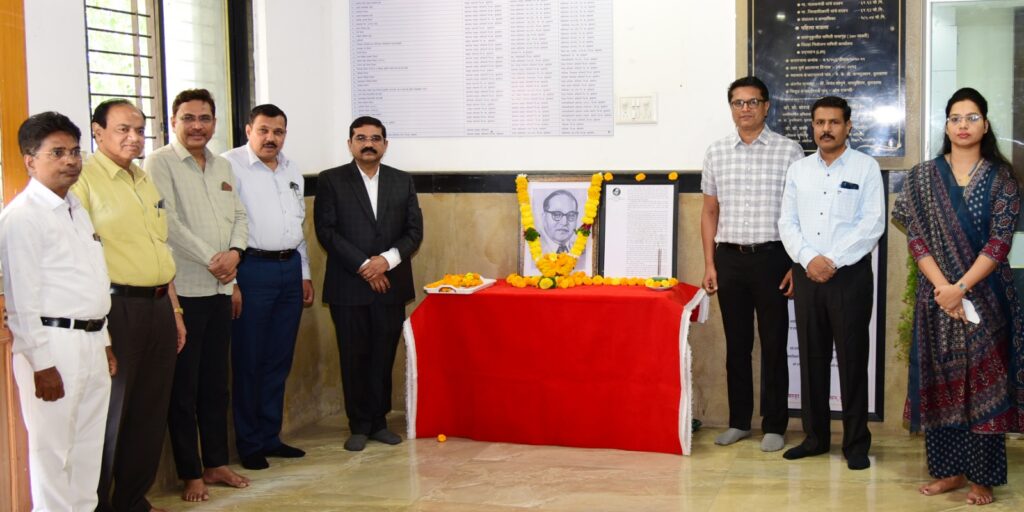 Tributes paid to Dr. Babasaheb Ambedkar at the Buldhana District Collector's Office.